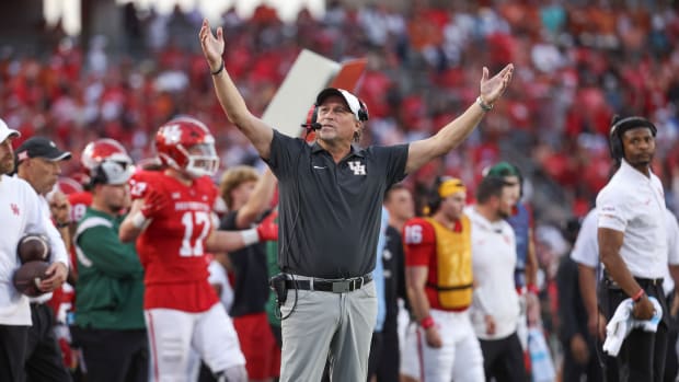 Houston Cougars head coach Dana Holgorsen reacts after a play during the fourth quarter against the Texas Longhorns at TDECU Stadium.